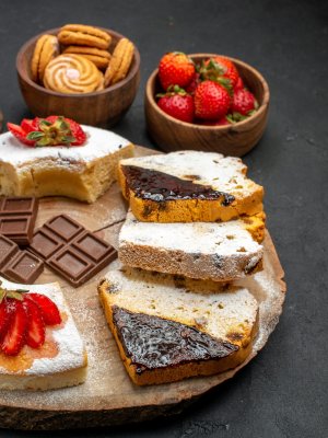 front-view-cake-slices-with-cookies-and-fruits-on-2026-03-18-11-54-25-utc