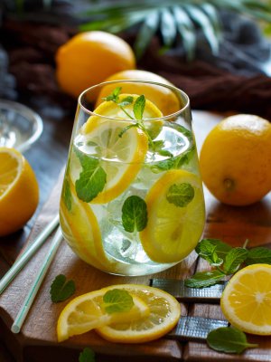 Homemade refreshing drink with lemon juice and mint close up
